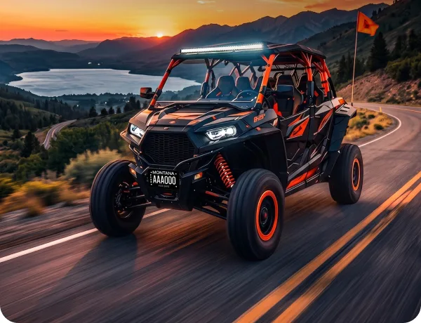 Off-road UTV on a mountain road at sunset